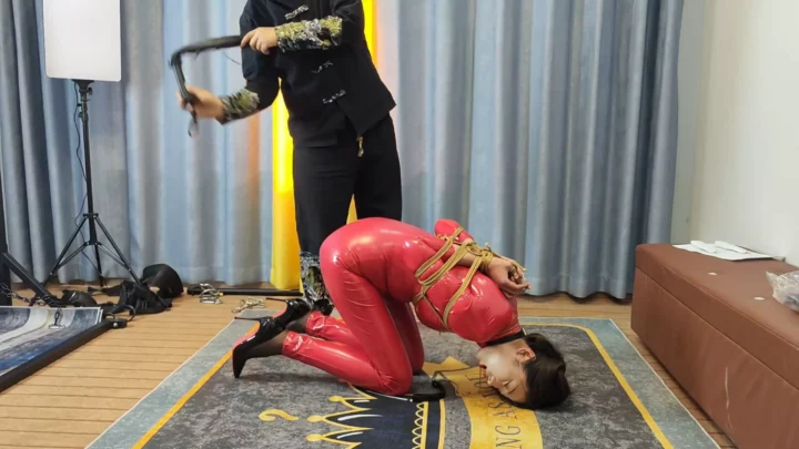 Jiajia’s Alluring Red Rubber Suit Bondage by Li Daxia