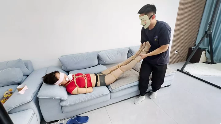 Blindfolded with tape, gagged with stockings