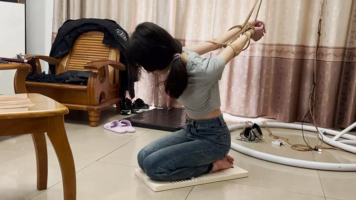 Pipi was tied up with her hands behind her back and kneeled on the washboard for punishment