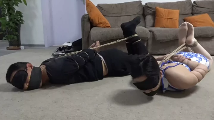 A scam of a tied up betting game: a couple being tied up in a happy and carefree way