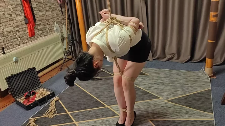 Screenshot 1 from Zi Han bends over and hangs tied up with a large ball gag, the theme is whipping